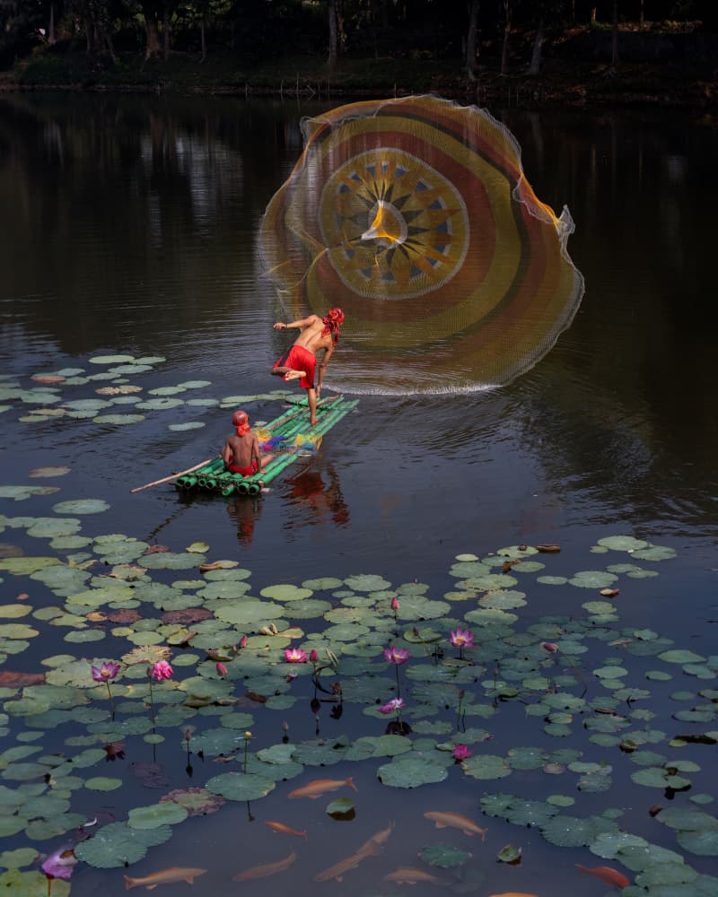 Fisherman's Vibrant Cast by Lisdiyanto Suhardjo — canvas wall art