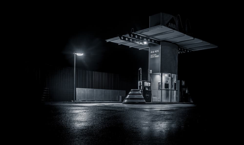 Wet Night Gas Station by Jörg Vollrath — canvas wall art