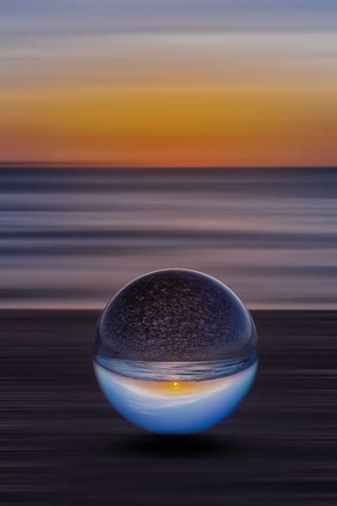 Ocean Sunset Crystal Globe by Bassant Meligy — canvas wall art
