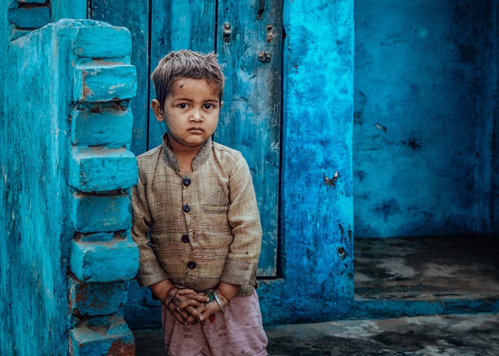Young Boy Blue Wall by ADIREK M — canvas wall art