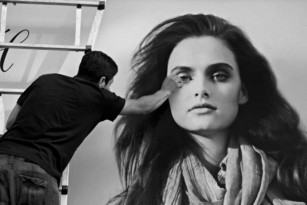 Man Creating Mural by Miguel Silva — canvas wall art