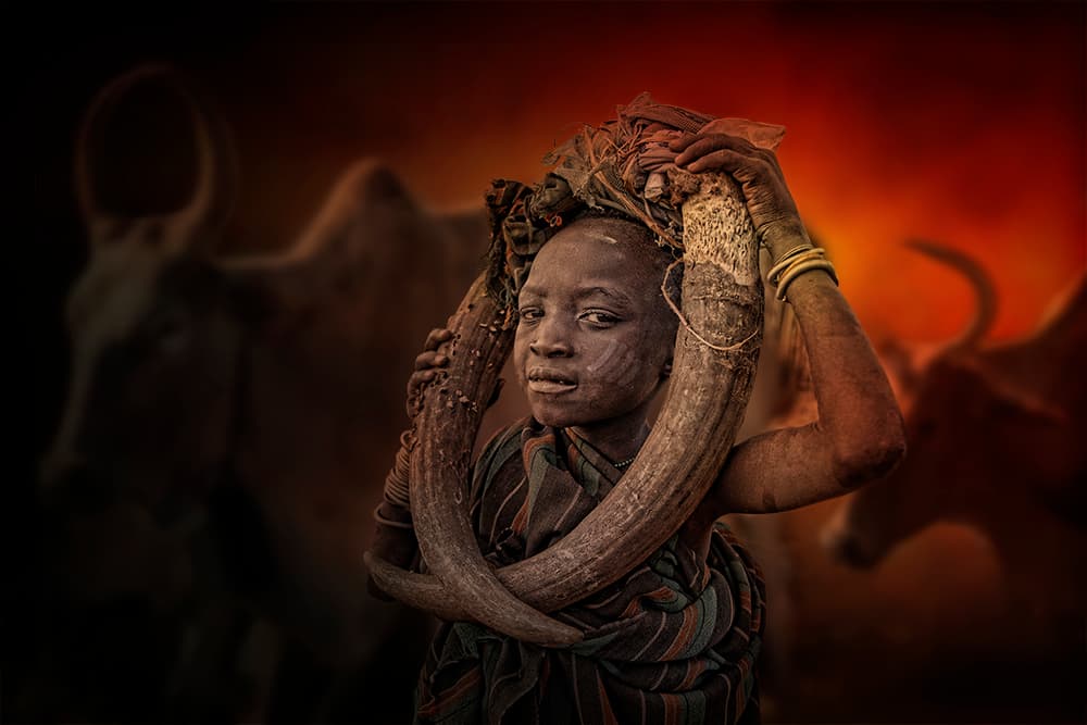 African Youth Carrying Horns by Svetlin Yosifov — canvas wall art