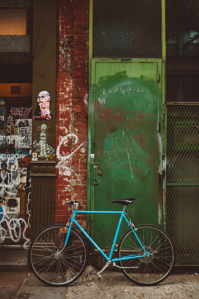 Blue Bicycle Green Door by Bethany Young — canvas wall art