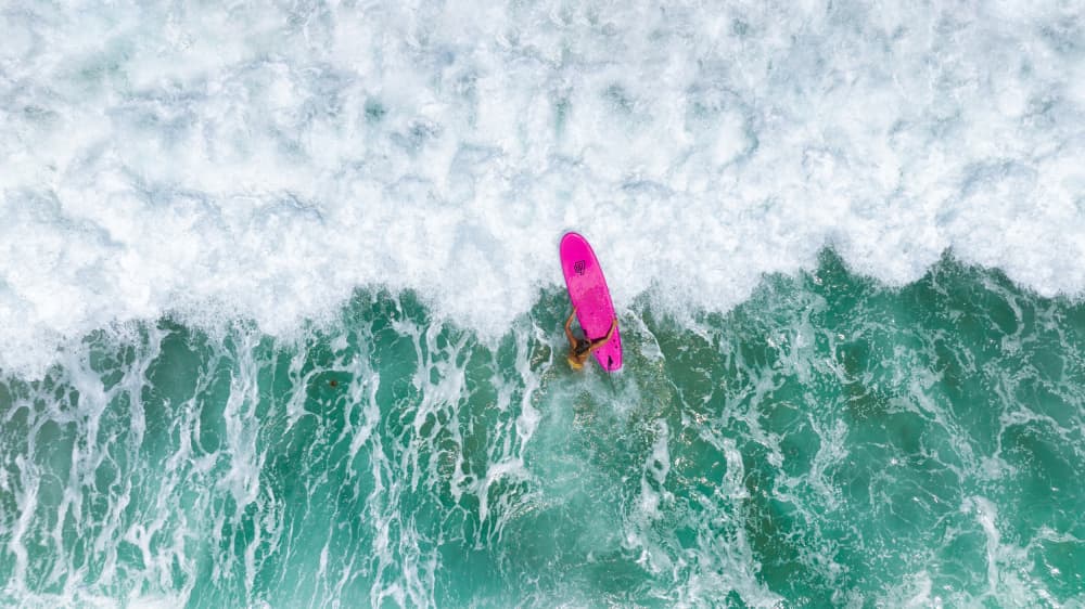 Pink Surfboard Ride by Ido Meirovich — canvas wall art