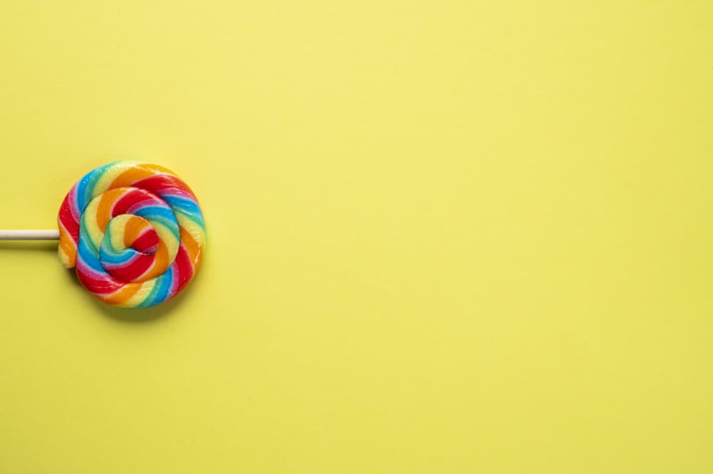 Rainbow Swirl Lollipop by Christa Stroo — canvas wall art