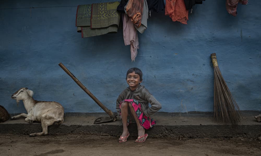 Happy Child with Goat by Kumar Kranti Prasad — canvas wall art