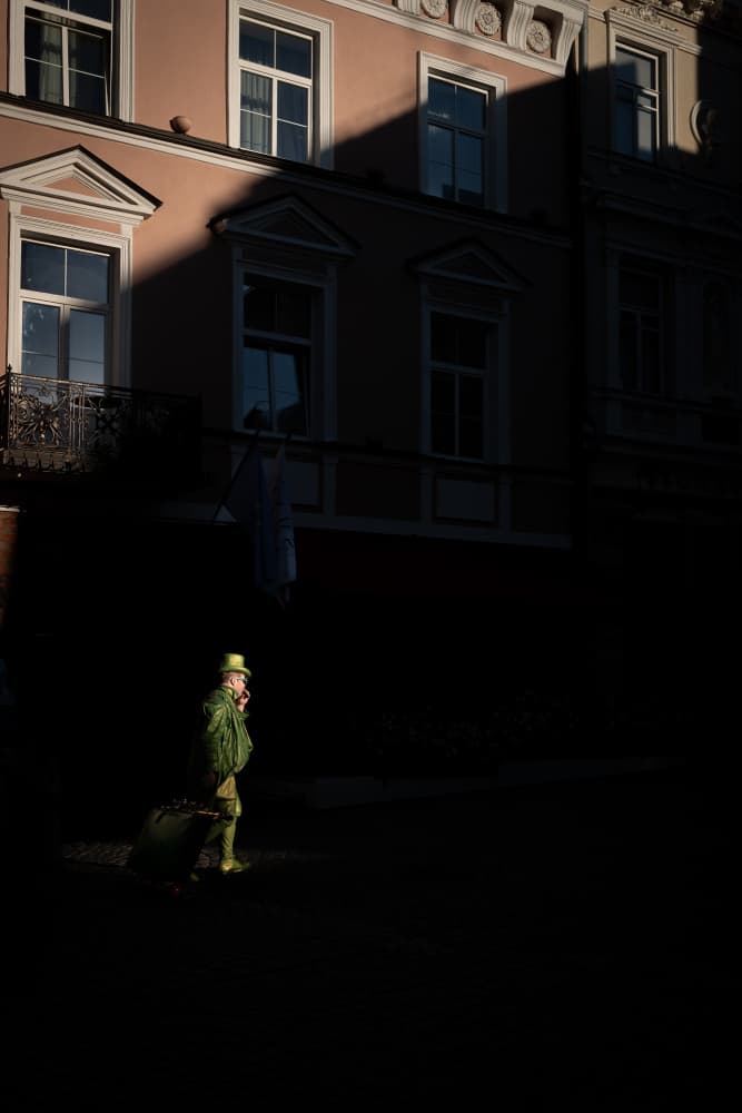 Green Hat Traveler by Alan Kwang — canvas wall art