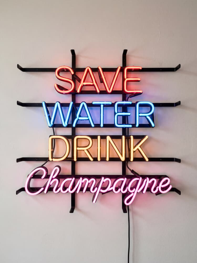 Witty Champagne Neon Sign by Andreas Magnusson — canvas wall art
