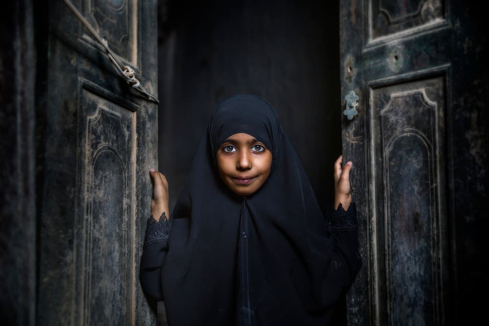 Curious Girl In Doorway by FATHI ALDARWISH — canvas wall art