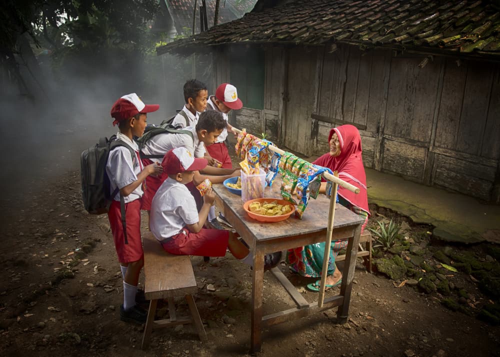 School Kids' Snack Time by Angela Muliani Hartojo — canvas wall art