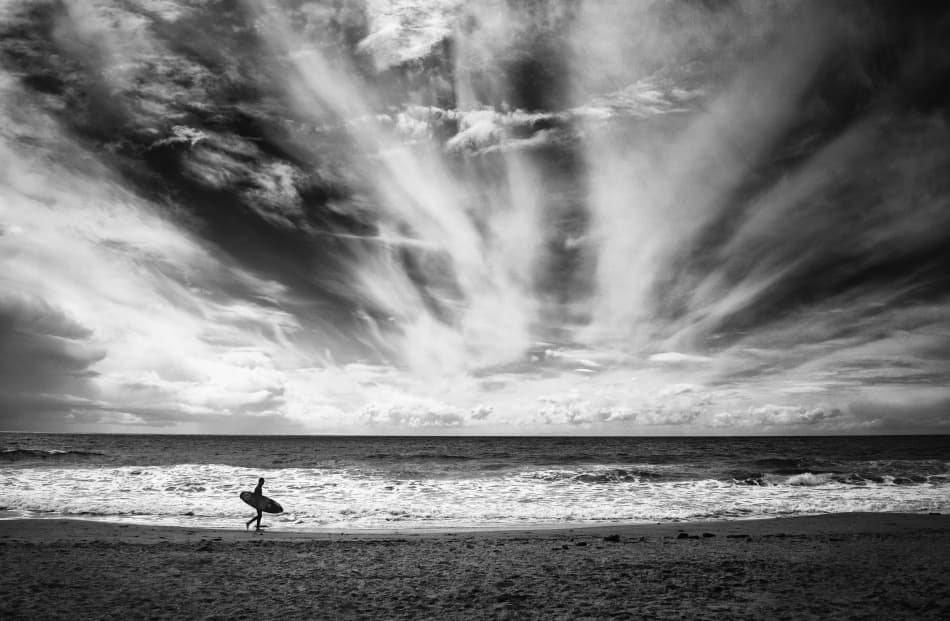 Lone Surfer Vast Sky by Lorenzo Grifantini — canvas wall art