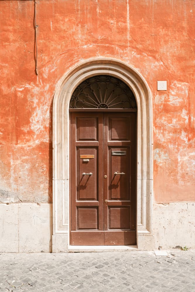 Historic Orange Doorway by Henrike Schenk — canvas wall art