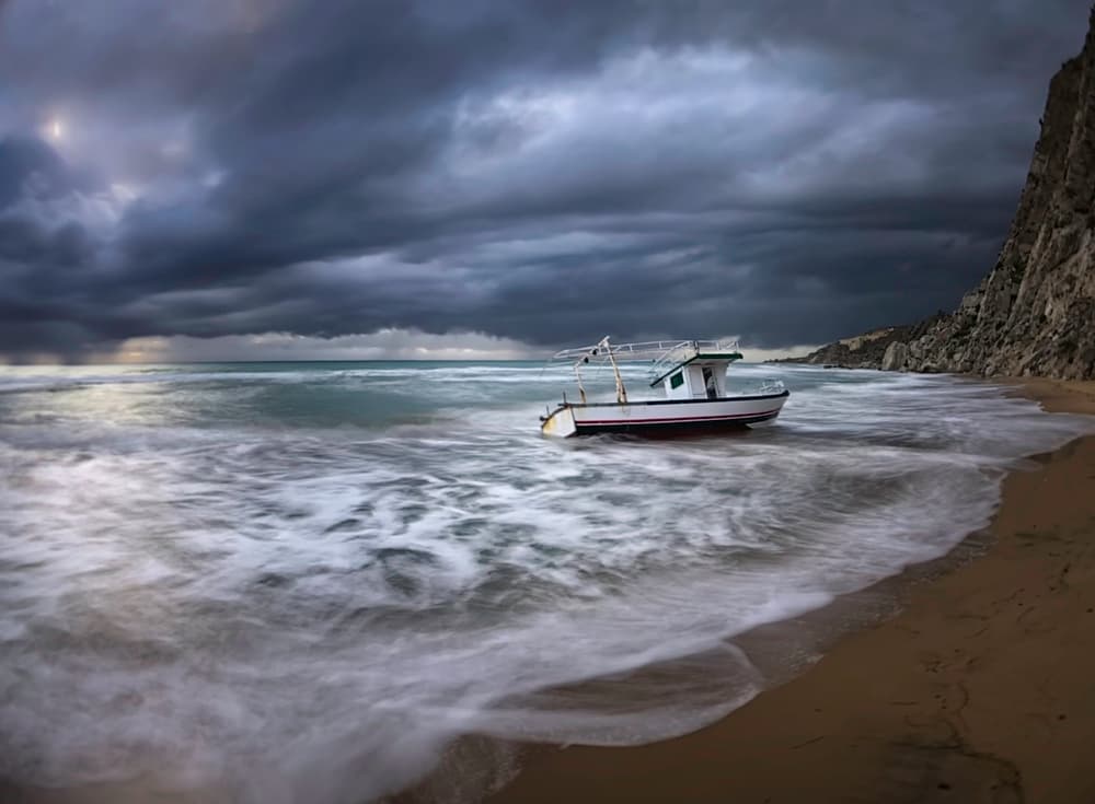 Lonely Boat Stormy Sea by Andrea Auf dem Brinke — canvas wall art