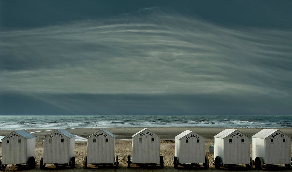 Cloudy Sky Beach Huts by Yvette Depaepe — canvas wall art