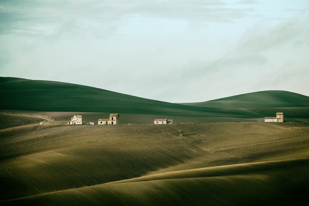Rolling Hills Distant Homes by Nicola Figliuolo — canvas wall art