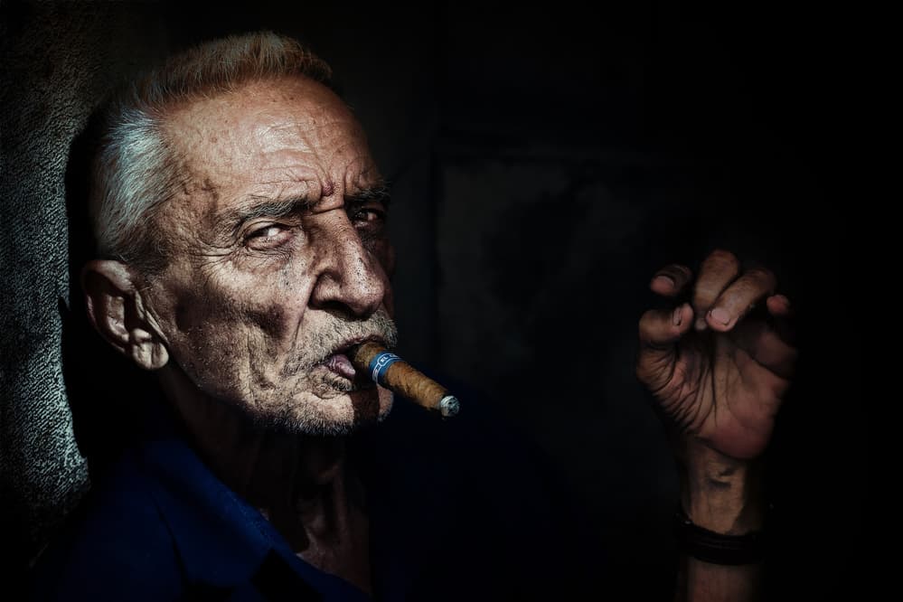 Intense Man Smoking Cigar by Trevor Cole — canvas wall art