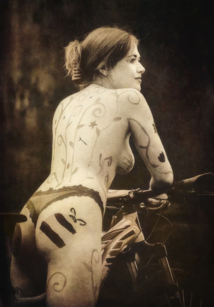 Painted Woman on Bike by Mia Meng — canvas wall art