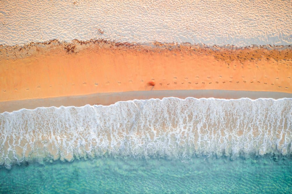 Serene Beach Footprints by Paolo Gelmini — canvas wall art