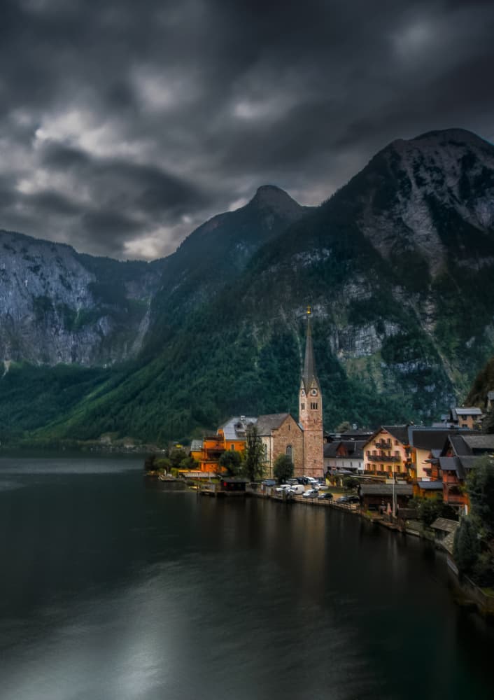 Dramatic Alpine Lake Village by Rana Jabeen — canvas wall art