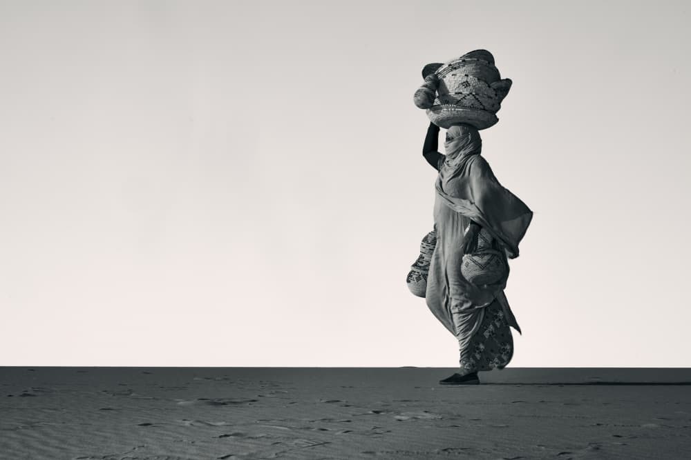 Lone Woman Desert Journey by ABDALLAH KHALILI — canvas wall art