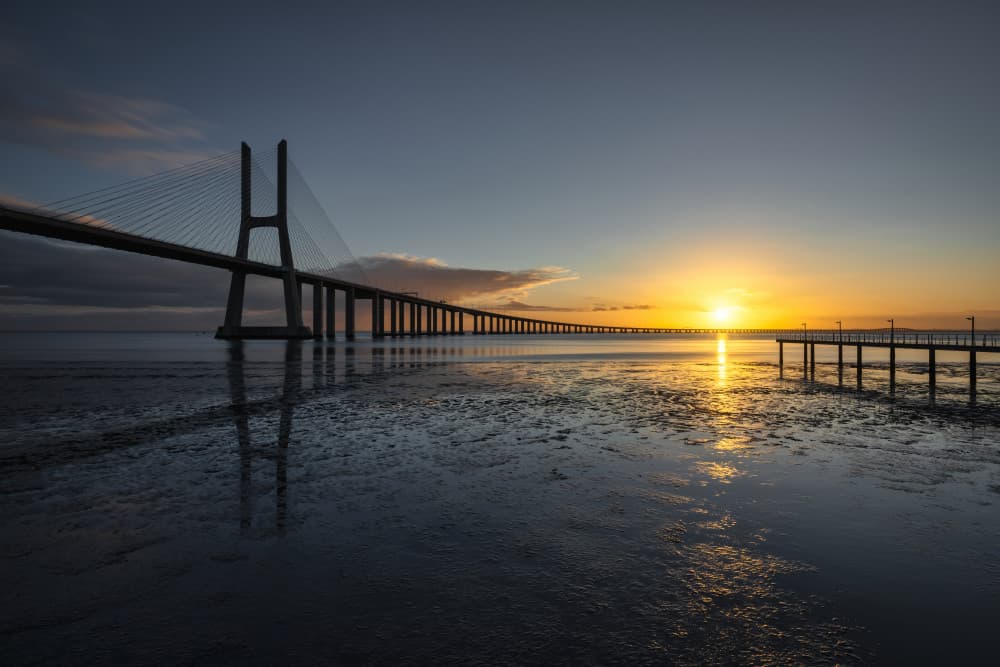 Golden Hour Bridge Reflection by Tomás Hueso Marco — canvas wall art