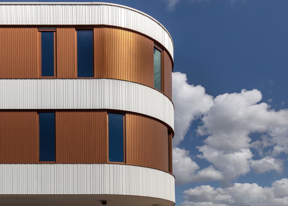 Curved Copper Building by Theo Luycx — canvas wall art