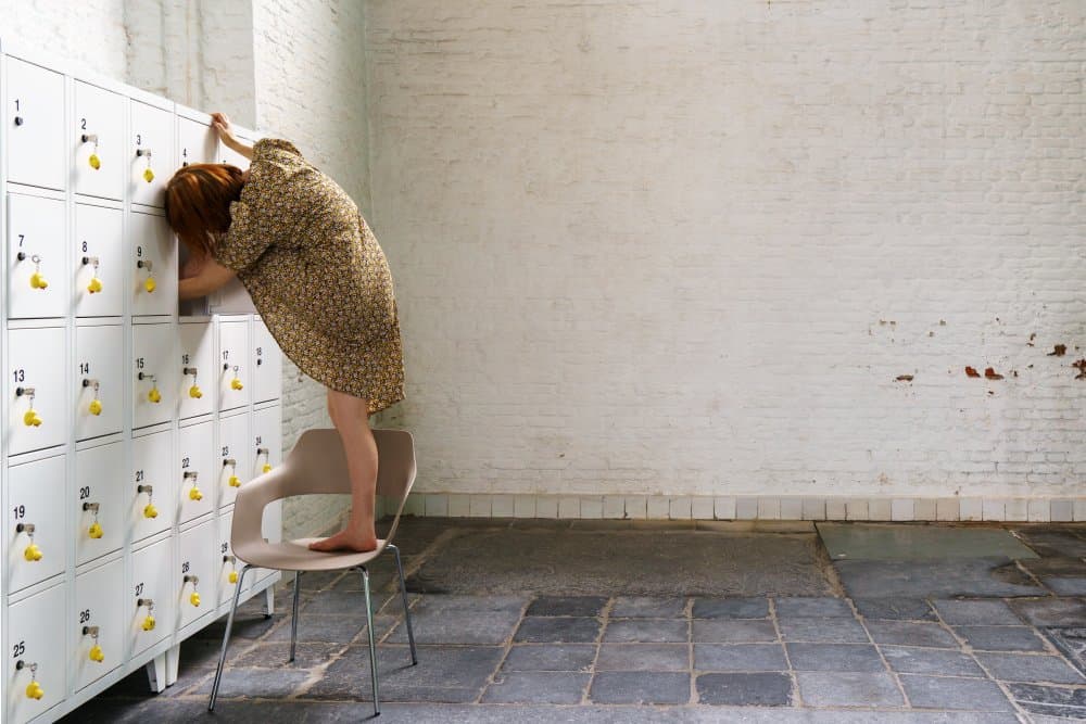 Woman Searching Locker by Ton Dirven — canvas wall art