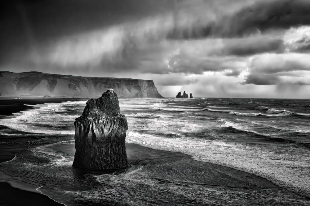 Dramatic Black Sand Sea Stack by Michel Groleau — canvas wall art
