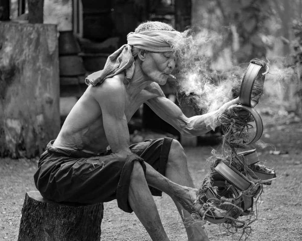 Smoking Artisan's Craft by Dev Sirikulthada — canvas wall art