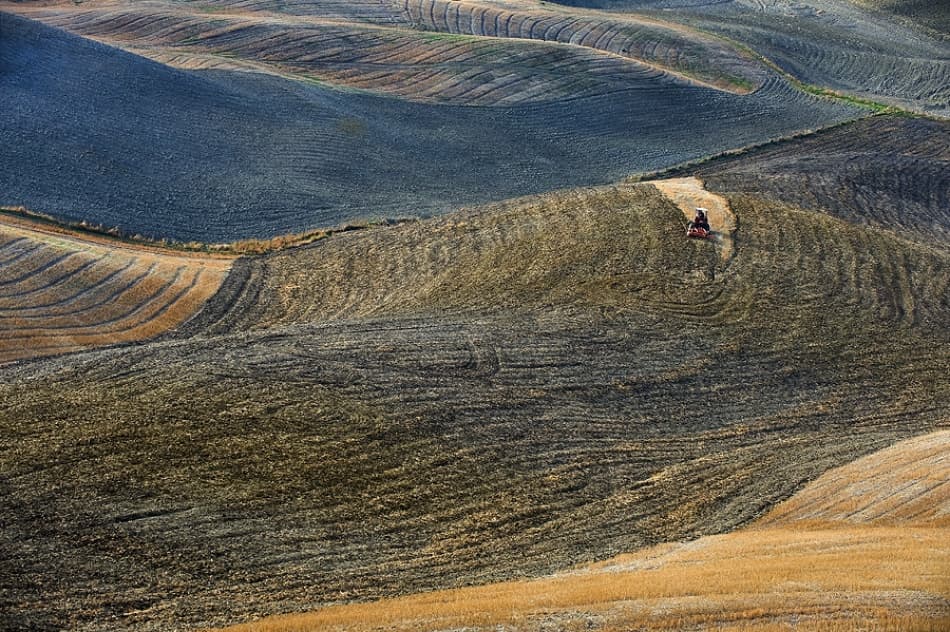 Tractor on Rolling Fields by Jure Kravanja — canvas wall art