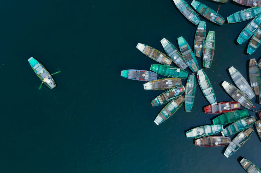 Boats on Calm Blue by Mozart Chan — canvas wall art
