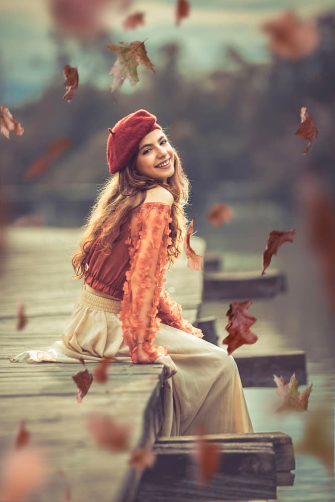 Smiling Woman Autumn Dock by Sharon Levy — canvas wall art