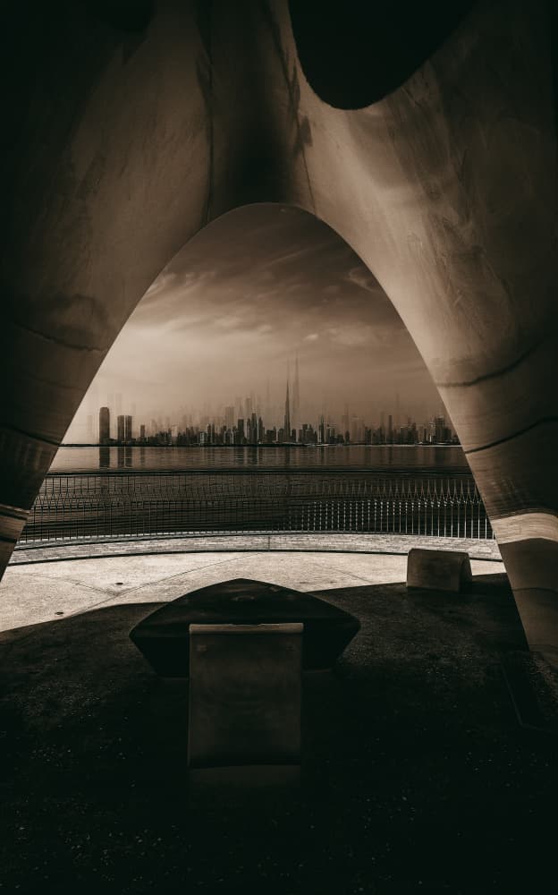 City Skyline Through Arch by Carmine Chiriacò — canvas wall art