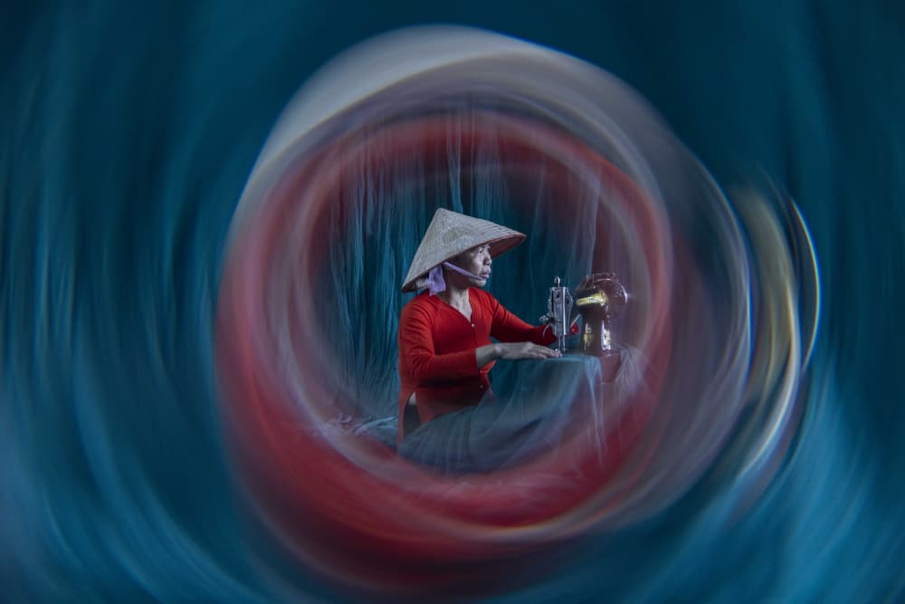 Woman Sewing Swirling Colors by Ella Waldman — canvas wall art
