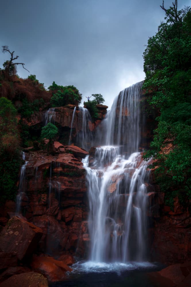 Dramatic Red Rock Falls by Ramamurthi Palaniraman — canvas wall art
