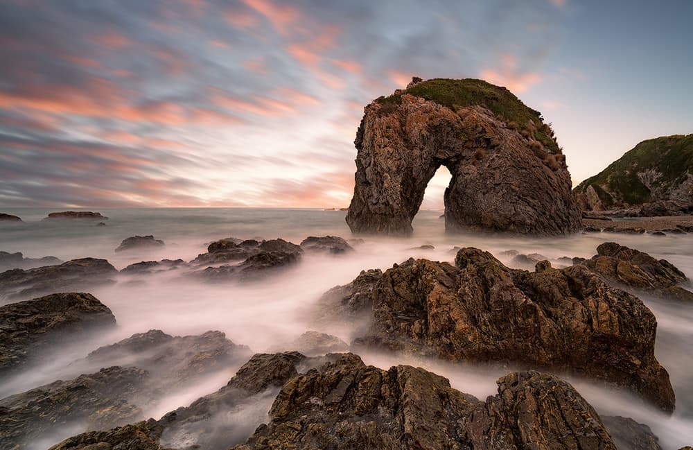 Coastal Arch Sunset by Jingshu Zhu — canvas wall art