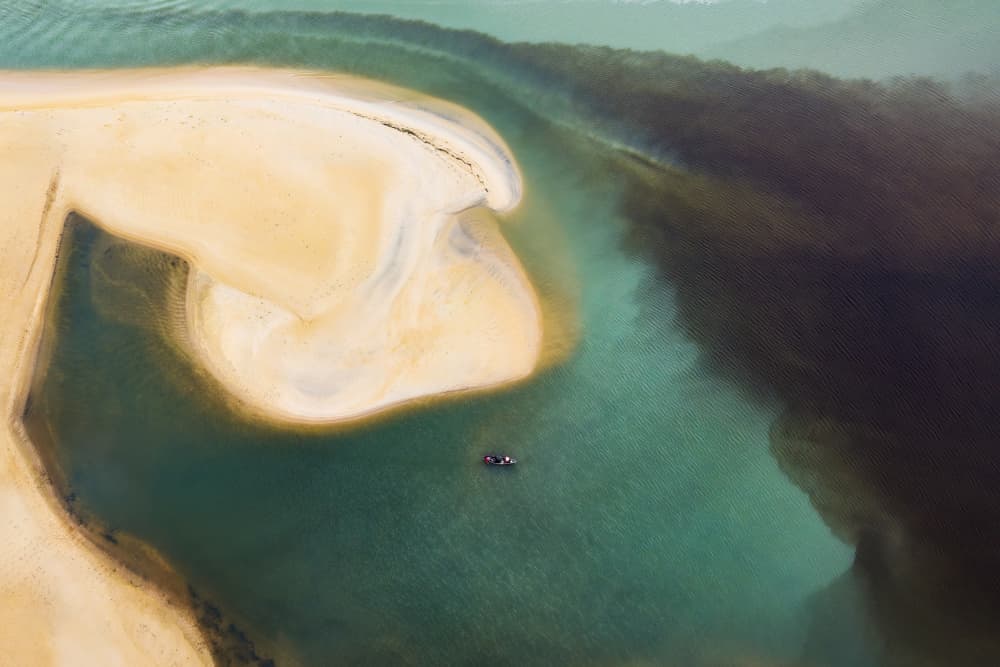 Tranquil Lagoon Boat by HuongHoang — canvas wall art