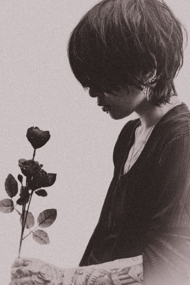 Woman Holding Dark Roses by Y — canvas wall art