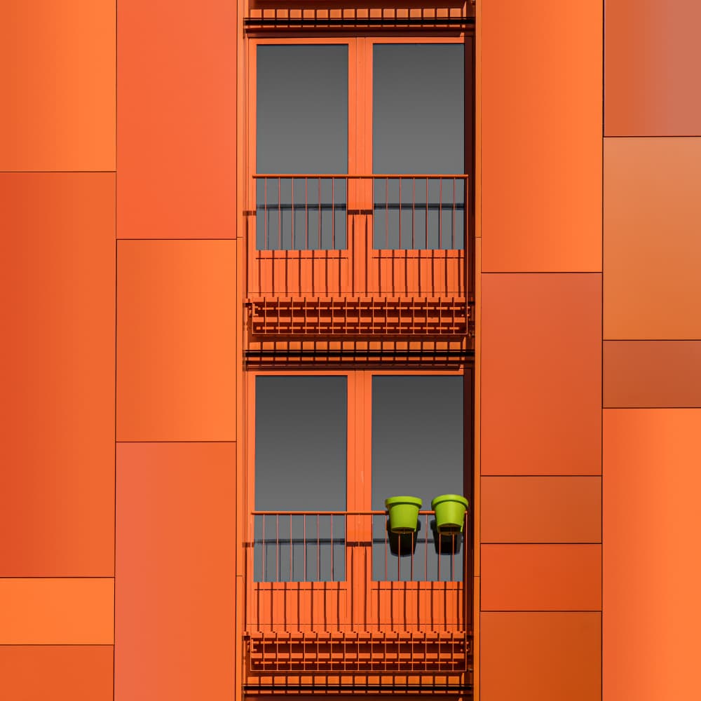 Vibrant Orange Balcony Pots by Luc Vangindertael (laGrange) — canvas wall art