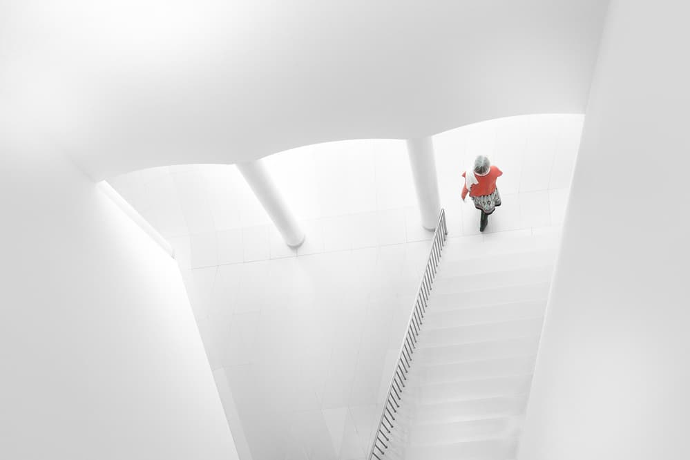Red Figure White Stairs by Andy Bauer — canvas wall art