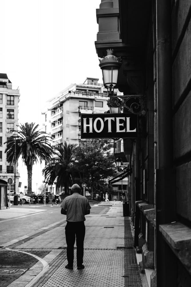 Man By City Hotel by Aimee Giles — canvas wall art