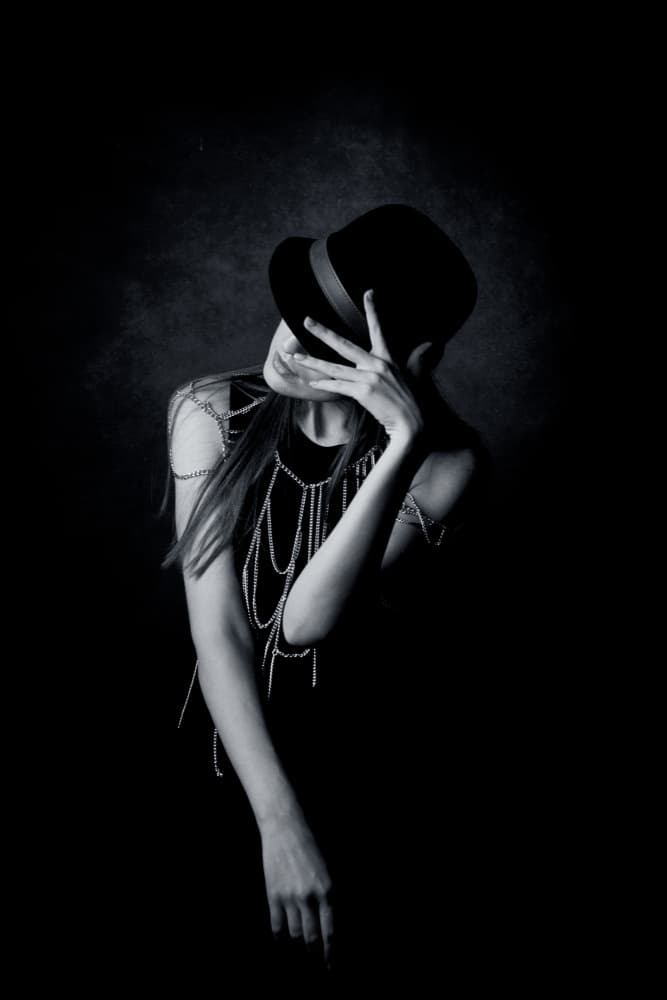 Mysterious Woman in Hat by Amnon Eichelberg — canvas wall art