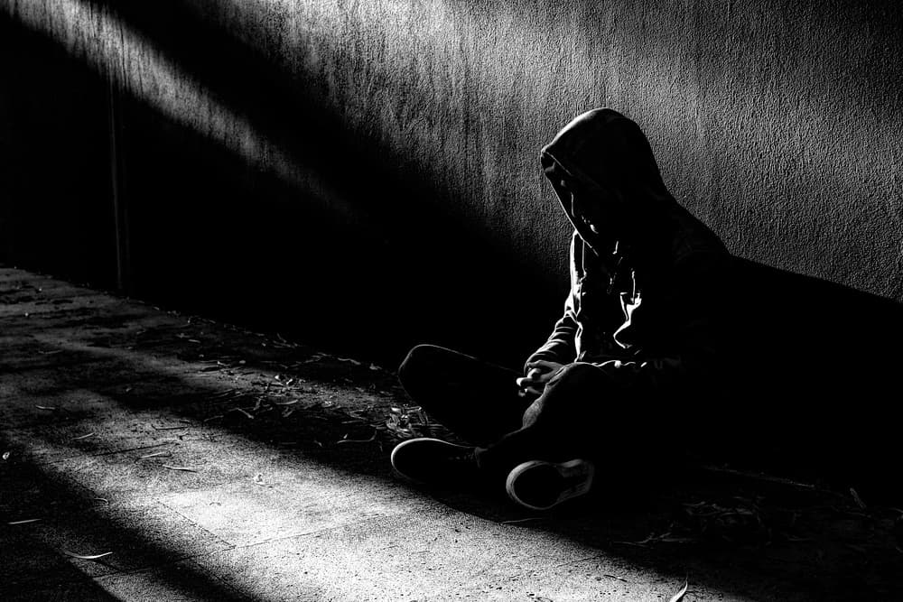 Hooded Figure in Shadow by Paulo Medeiros — canvas wall art
