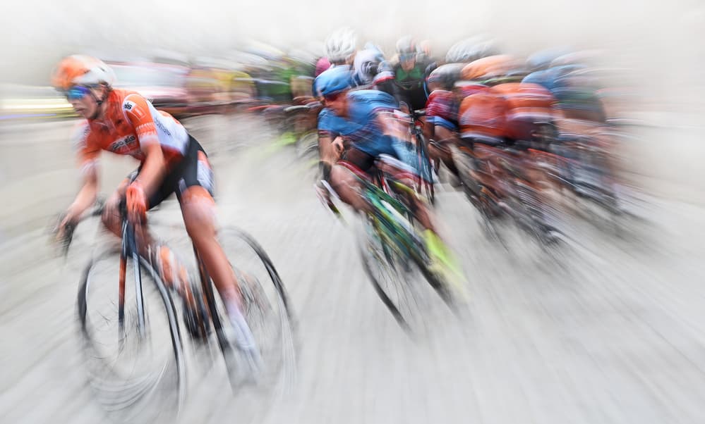 Racing Cyclists Blur by Lou Urlings — canvas wall art