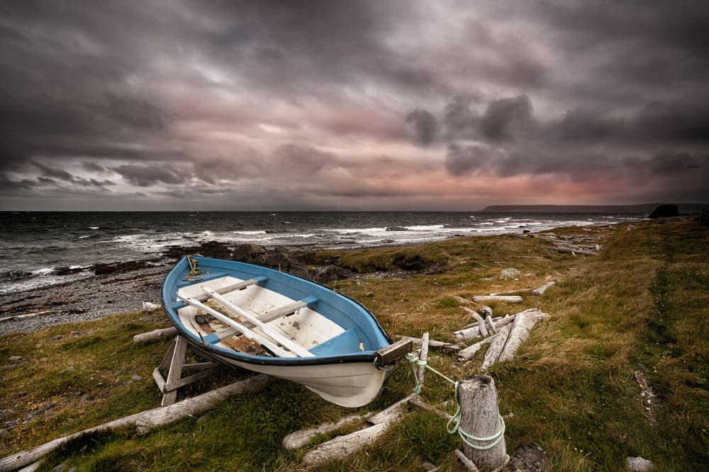 Dramatic Coastal Boat by Þorsteinn H. Ingibergsson — canvas wall art