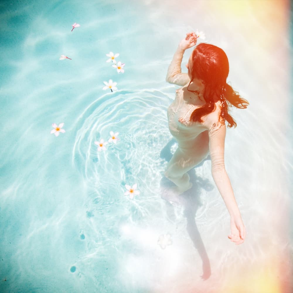 Serene Woman Floating Flowers by Mel Brackstone — canvas wall art