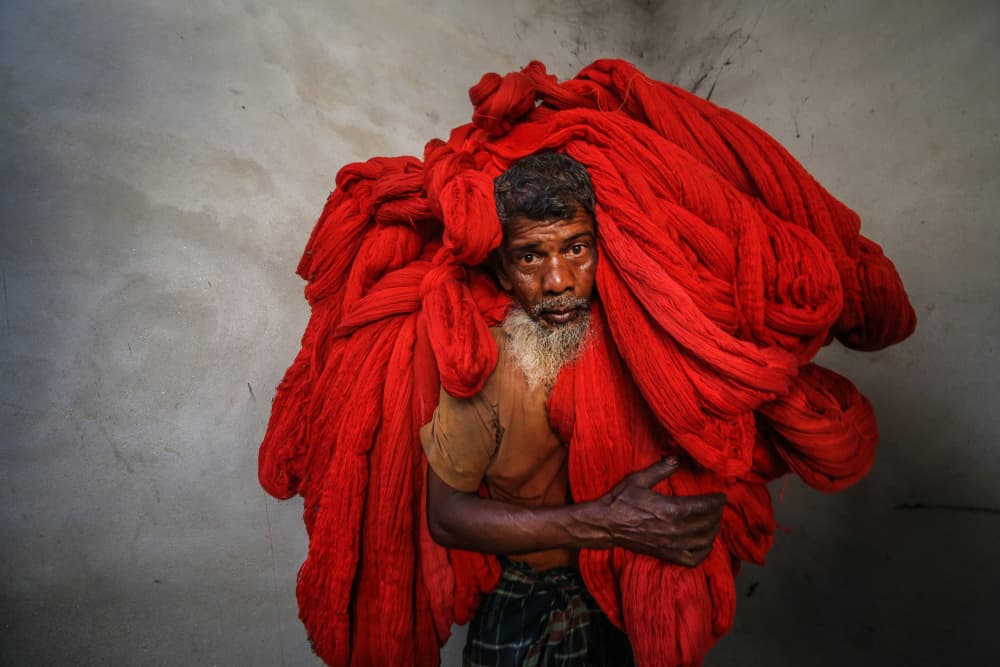 Man's Red Burden by Ummu Nisan Kandilcioglu — canvas wall art