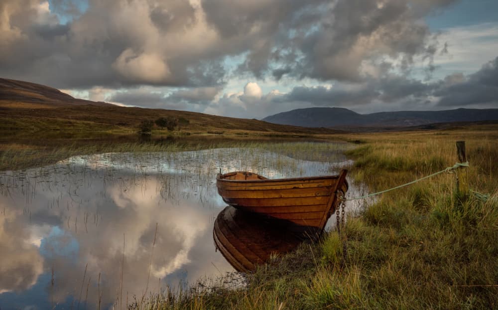 Reflected Wooden Boat by Anne Berger — canvas wall art
