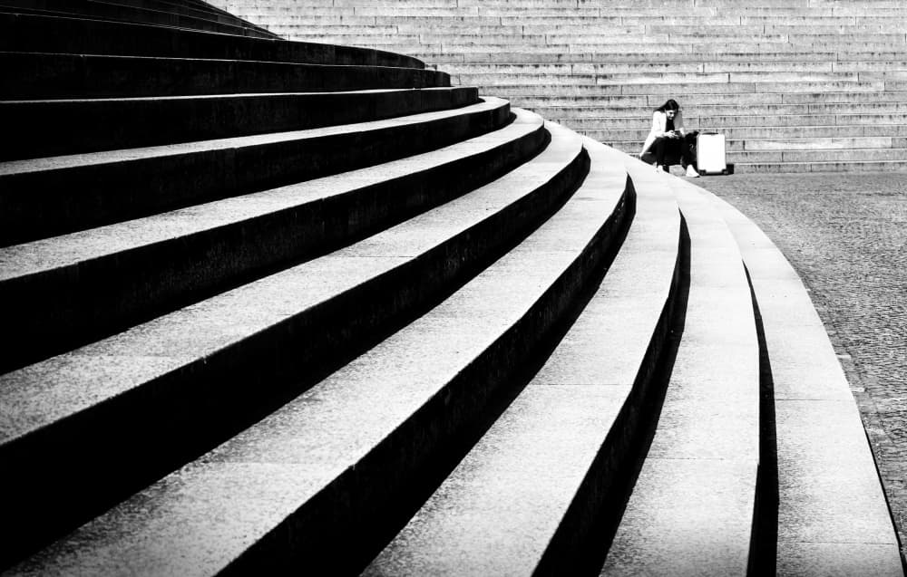 Contemplation on City Steps by Anna Niemiec — canvas wall art
