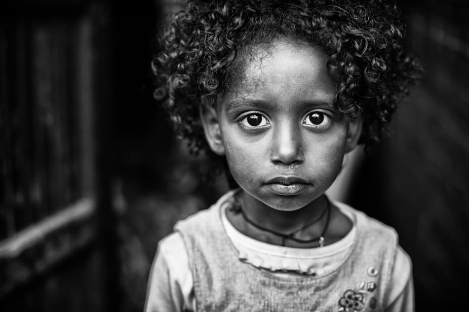Girl's Solemn Gaze by Goran Jovic — canvas wall art